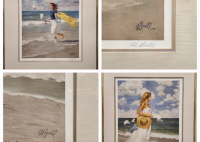 Four framed beach-themed watercolor paintings, each signed and featuring ocean scenes and figures.