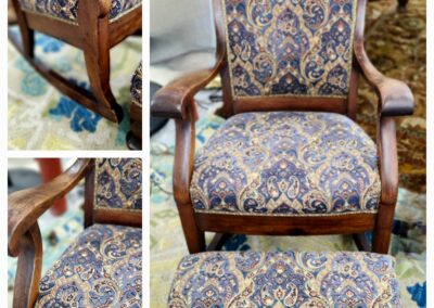 Elegant wooden armchair with intricate blue and gold upholstery.