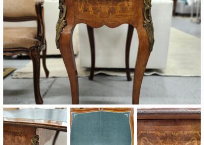 Elegant antique wooden side table with curved legs and intricate carvings.