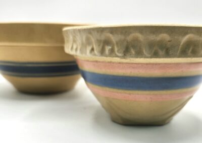 Two ceramic bowls with striped and wavy patterns.