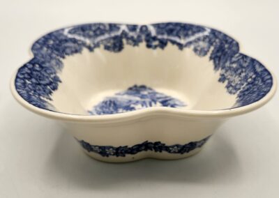 Vintage blue and white ceramic bowl with floral pattern.