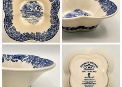 Blue and white ceramic serving bowl with floral patterns and scalloped edges.