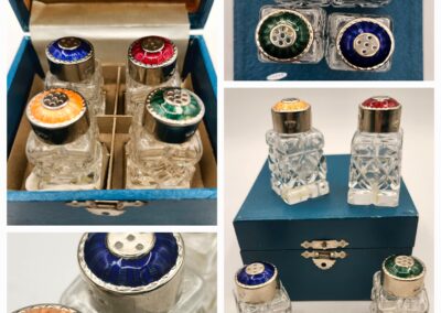 Vintage glass salt and pepper shakers with colorful lids in a decorative box.