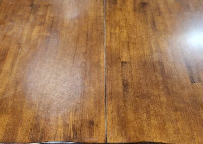 A polished wooden table with a warm brown finish.