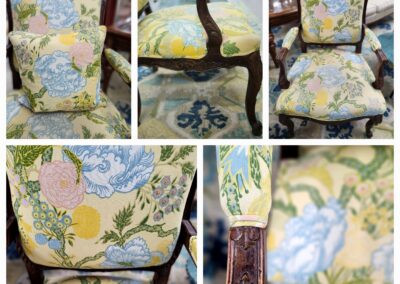 Antique chair with ornate floral upholstery and carved wood details.