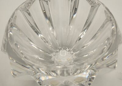 Clear glass bowl with a fluted design.