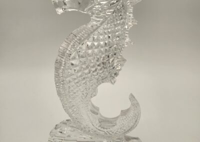 Intricately designed glass seahorse sculpture with detailed textures.