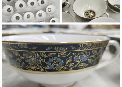 Elegant porcelain tea cups with intricate blue and gold floral designs.