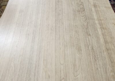 A clean, light wooden table with a smooth surface.