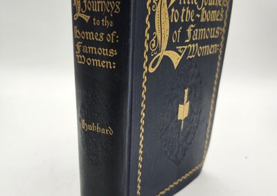 Old hardcover book titled 'Poetical Works of Sir Walter Scott' with ornate gold detailing.