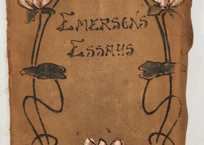 Vintage book cover with floral design and ornate text.