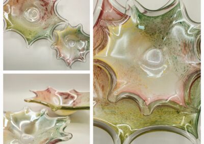 Three views of a decorative glass bowl with star-like edges in muted green and pink tones.