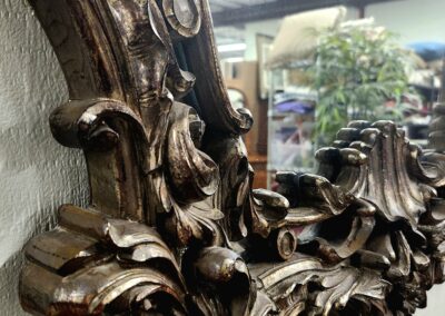 Close-up of ornate wooden carvings on antique furniture.