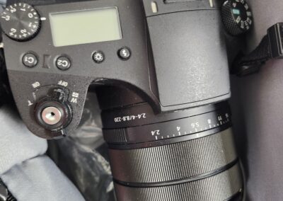 Close-up of a Sony camera with a zoom lens attached.