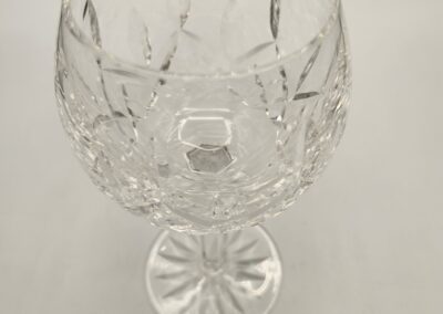 Elegant cut crystal goblet with intricate designs.