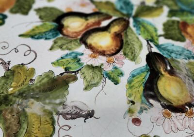 Watercolor pears and leaves painted in vibrant colors on paper.