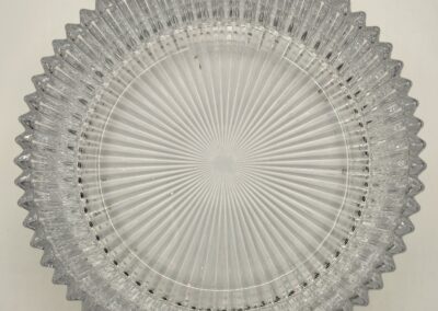 Intricate circular pattern with radiating lines and geometric shapes.