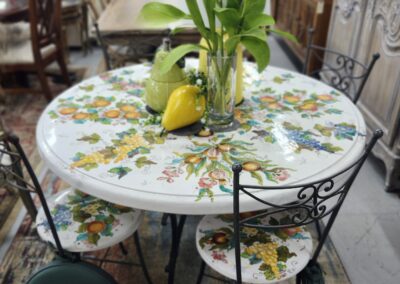 Vintage floral table setting with lemon centerpiece and matching cushions.