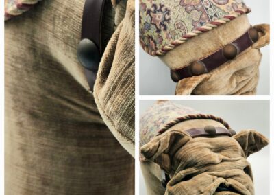 Close-up of a textured, fabric-wrapped sculpture resembling a pug dog.
