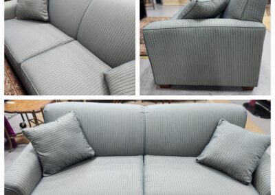 Modern gray sofa with clean lines and matching cushions in a cozy living space.