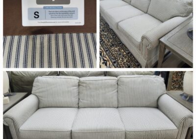 A light gray Broyhill sofa with a textured fabric and matching cushions.