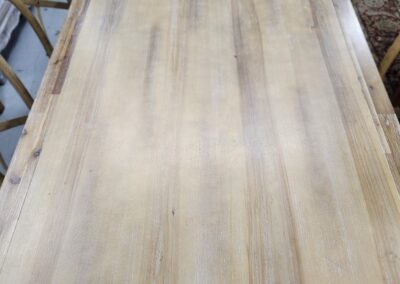 Smooth wooden tabletop with light natural grain.