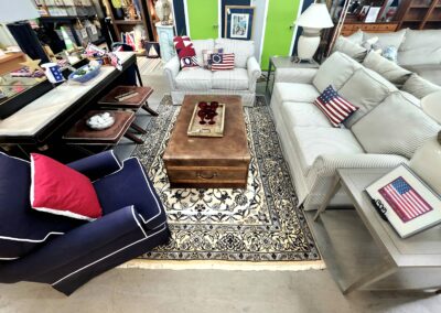Cozy living room with colorful furniture and patterned rug.
