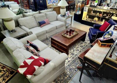 Cozy living room with patterned sofas and a decorative rug.