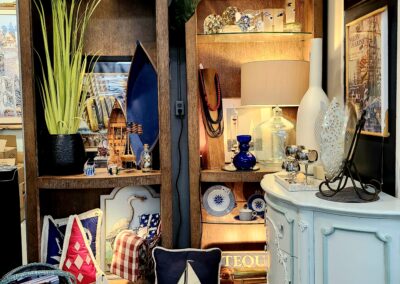 Cozy corner with decorative pillows and warm lighting in a rustic setting.