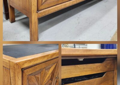 Wooden cabinet with intricate geometric carvings and multiple drawers.