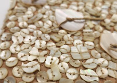 A close-up of wooden buttons arranged on a flat surface.