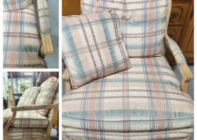 Vintage plaid armchair with cushioned seat and matching pillow.