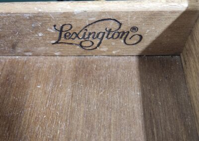 Close-up of a wooden drawer with 'Lexington' logo inside.