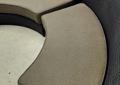 Curved cushioned seating in neutral tones creating a cozy corner.