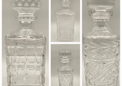 Five views of ornate glass decanters with intricate cut designs and stoppers.