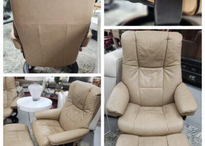 Beige cushioned office chair with armrests and wheels.