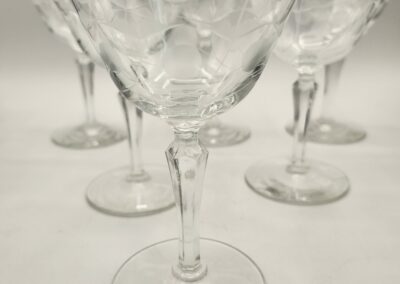 A set of empty wine glasses arranged together.