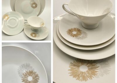 Elegant white ceramic dinnerware with gold floral designs.