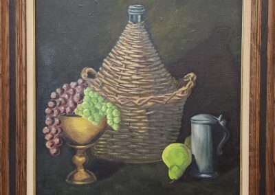 Still life painting with grapes, a green pear, a jug, and a woven bottle.