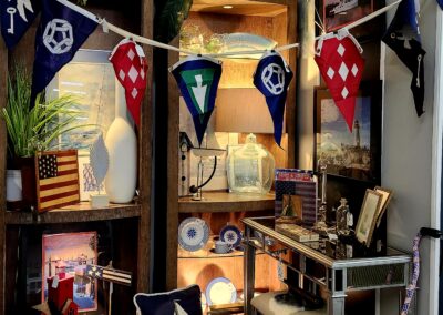 Cozy vintage-themed room with nautical decor and warm lighting.