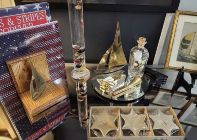 A collection of vintage and decorative items on display, including bottles and trays.
