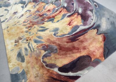 Abstract watercolor painting with swirling earthy tones and blues.