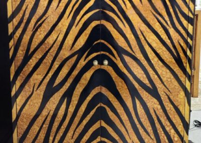Close-up of a tiger-striped pattern on fabric or upholstery.