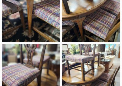 Vintage wooden dining chairs with patterned cushions arranged around a wooden table.