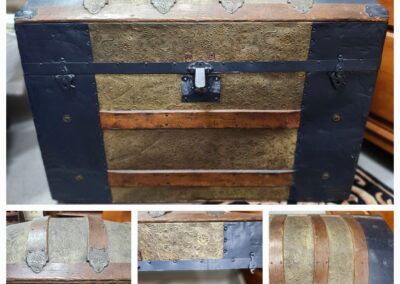 Rustic vintage wooden chest with metal bands and a lock in a cozy indoor setting.