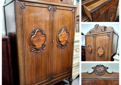 Antique wooden wardrobe with intricate carved details and elegant design.