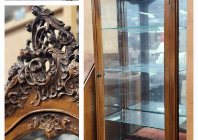 Ornate wooden display cabinet with glass shelves and carved floral details.