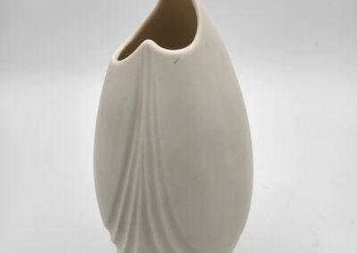 Elegant white ceramic vase with a smooth, curved design.