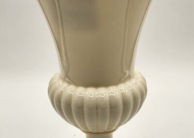 Elegant cream-colored ceramic vase with fluted design.