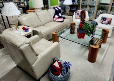 Comfortable living room with beige sofas and colorful cushions.